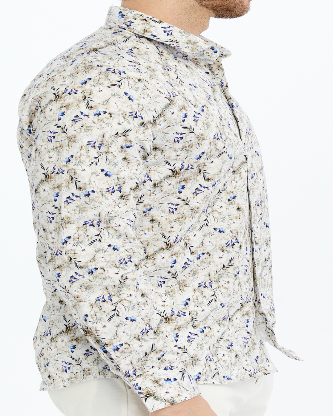 Men floral patterned printed shirt on a brownish background